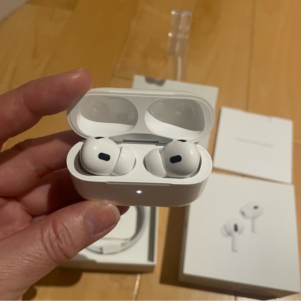 Apple Airpods 2nd Gen. USB-type C charger and extra ear pieces included.